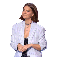 a woman wearing a striped jacket and a choker necklace