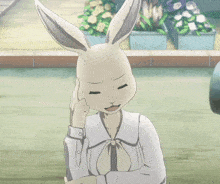 a white rabbit with a white shirt and tie is standing in front of flowers