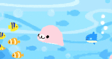 a pixel art drawing of fish and a pink whale