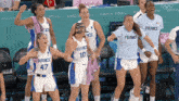 a group of female basketball players wearing jerseys that say france