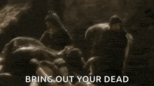 a group of people standing around a pile of dead bodies with the words `` bring out your dead '' written on the bottom .