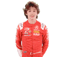 a young man in a red racing suit with akm motorsport written on it