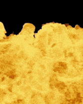 a close up of a large explosion with a lot of flames and smoke coming out of it .