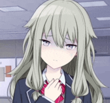 a close up of a girl with long hair wearing a school uniform and a tie .
