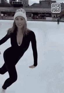 a woman is ice skating in front of a snack shop