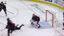 a hockey game is being played in front of a banner for enterprise