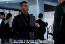 a man in a suit and tie says " you mean the simone that spent all that time creating that dope ass highlight reel
