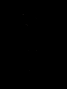 a close up of a woman 's face in the dark .