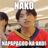 a young man wearing a red shirt has a meme on his face that says nako napapagod na ako