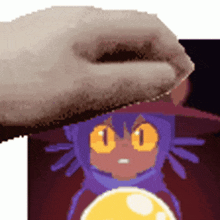 a pixelated image of a person holding a cartoon character 's head