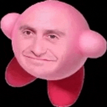 a close up of a pink kirby with a man 's face .