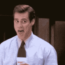 Laugh Jim Carrey GIF - Laugh Jim Carrey Coffee GIFs