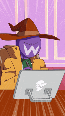 a cartoon character wearing a witch hat is sitting in front of a laptop