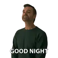 a man with a beard is wearing a green shirt