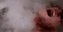 a close up of a person laying in a bathtub with blood on their face .