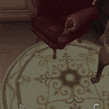 a cartoon character is standing next to a chair and a rug