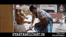 a man is cleaning the ground with a broom in a video that was made with vivavideo