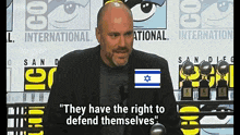 a man in front of a sign that says international