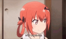 a girl with red hair is standing in front of a door and talking .