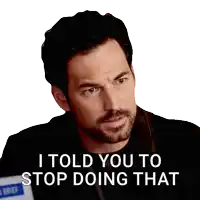 a man with a beard has a sticker that says i told you to stop doing that