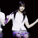 a girl in a school uniform is dancing on a stage and the word rabbit is on the bottom