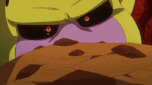 a close up of a cartoon character 's face with orange eyes
