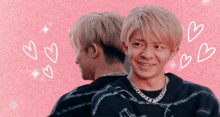 a man with blonde hair is smiling and looking at the camera
