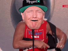 a man wearing a blizzard hat and a trump vince shirt