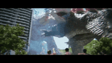 a group of people are standing in front of a statue of a dinosaur