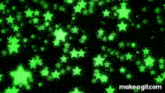 a bunch of green stars on a black background