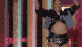 a woman dancing in front of a sign that says tesouki