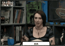 a woman named ava is sitting in front of a book shelf