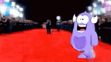 a purple monster is walking down a red carpet