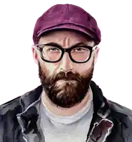 a man with glasses and a beard wearing a purple hat