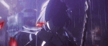 a girl is holding a sword in the rain in a dark room .