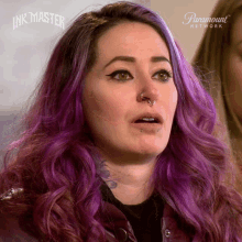 a woman with purple hair and a nose ring is on a paramount network tv show