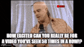 a bald man with a mohawk is talking into a microphone while being recorded ..