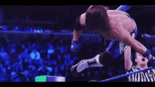 a wrestler with the letter t on his leg