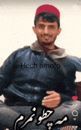 a man wearing a red hat and a black jacket is smiling with the words hech amoto above him