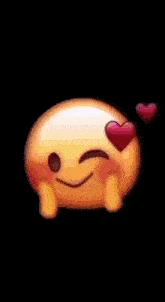 a smiley face with hearts in its eyes is making a heart shape with its hands .