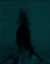 a blurred image of a person standing in front of a wall with chinese writing