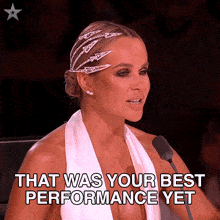 a woman sitting in front of a microphone with the words that was your best performance yet written below her