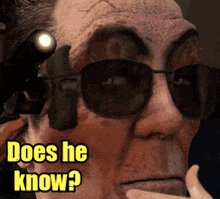 a man wearing sunglasses and a gun has the words does he know written on his face