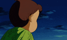 a cartoon character with a green swirl on his shirt