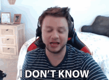 a man wearing headphones says " i don 't know "