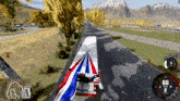 a red white and blue truck is driving down a highway