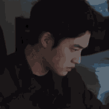 a close up of a man 's face with a blurred background .