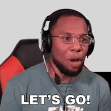 a man wearing headphones and glasses is saying let 's go .