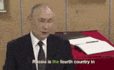 a man in a suit and tie is talking about russia being the fourth country in the world