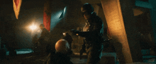 a man in a black helmet is kicking another man